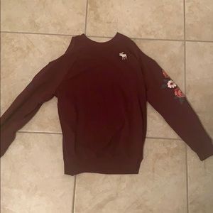 An off the shoulder long sleeve shirt